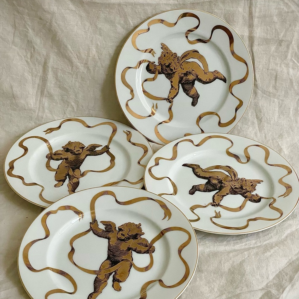 Vintage Neiman Marcus porcelain dessert plates with a gilded cherub set of 4